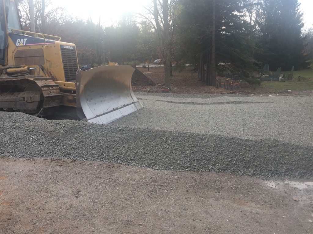 Grading driveway aggregate with Cat Dozer