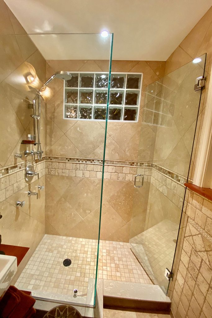 Grohe Shower and Travertine Tile Bathroom
